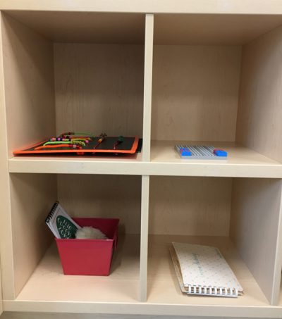 4 separate cubbies with various activities in each